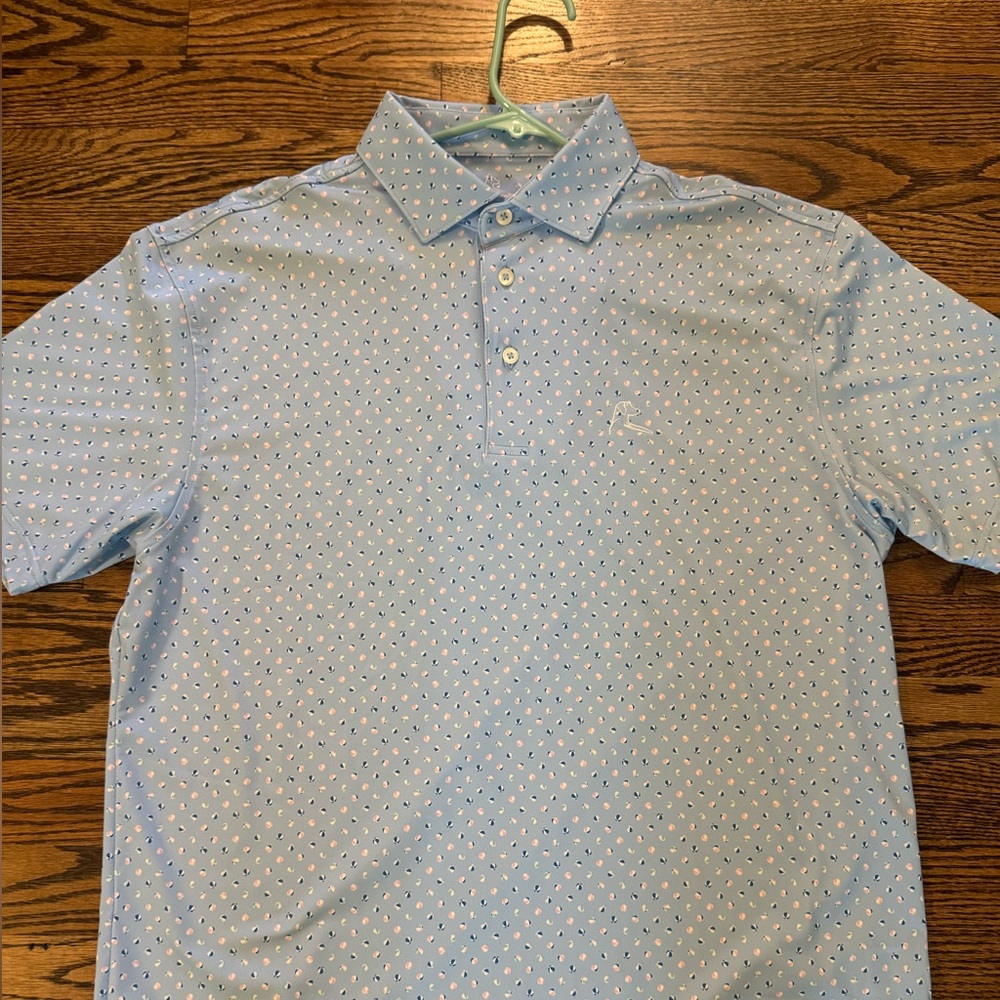 Medium rhoback polo. New without tags. Beach ball pattern.
